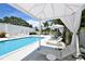 Relaxing pool area with shaded cabanas and lounge chairs at 711 S Palm Ave # 203, Sarasota, FL 34236