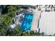 Aerial view of refreshing pool with lounge chairs and cabanas at 711 S Palm Ave # 203, Sarasota, FL 34236