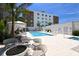 Inviting pool area with fire pit and lounge seating at 711 S Palm Ave # 203, Sarasota, FL 34236