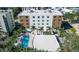 Aerial view of a modern building with a refreshing pool area at 711 S Palm Ave # 203, Sarasota, FL 34236