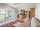 Relaxing Gathering room featuring a sofa, sliding glass doors to a patio, and an area rug at 7402 9Th W Ave, Bradenton, FL 34209