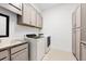 Laundry room with washer, dryer, cabinets and countertop at 8276 Redonda Loop, Lakewood Ranch, FL 34202