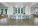 Modern community bar with a curved countertop and teal stools at 10214 Crystal Isle Cir, Sarasota, FL 34241