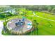 Aerial view of a playground with play structures, benches, and shaded areas at 10214 Crystal Isle Cir, Sarasota, FL 34241