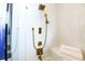 Luxurious shower with gold fixtures and built-in bench at 1155 N Gulfstream Ave # 908, Sarasota, FL 34236