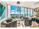 Elegant sitting area with water views and plush seating at 1155 N Gulfstream Ave # 908, Sarasota, FL 34236