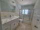 Updated bathroom with modern vanity and a shower at 1732 Boca Raton Ct, Punta Gorda, FL 33950