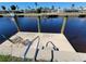 Private dock with seating and steps for easy water access at 1732 Boca Raton Ct, Punta Gorda, FL 33950