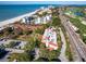 Aerial view showing the building's proximity to the beach and golf course at 2055 Gulf Of Mexico Dr # G2-102, Longboat Key, FL 34228