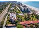 Aerial view of the property and its surrounding beach and coastal area at 2055 Gulf Of Mexico Dr # G2-102B, Longboat Key, FL 34228