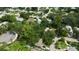 Aerial view showcasing a residential neighborhood with lush trees and houses at 2141 Clematis St, Sarasota, FL 34239