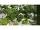 Aerial view of a home surrounded by lush landscaping and mature trees at 2141 Clematis St, Sarasota, FL 34239