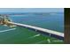 Aerial view showcasing the bridge, coastline, and surrounding turquoise water at 2141 Clematis St, Sarasota, FL 34239