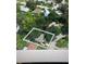 An aerial view showing the property, neighboring houses, and surrounding trees at 2141 Clematis St, Sarasota, FL 34239