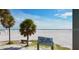 View of Siesta Beach with palm trees and the 'Siesta Key Beach' sign at 2141 Clematis St, Sarasota, FL 34239