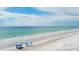 Beach umbrellas on a pristine, sandy beach at 2141 Clematis St, Sarasota, FL 34239