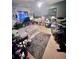 Bedroom with drumset, carpet, and comfortable bed setup at 2141 Clematis St, Sarasota, FL 34239