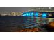 Night view of a bridge lit up with blue lights against the backdrop of a city skyline at 2141 Clematis St, Sarasota, FL 34239