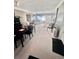 Open-concept living and dining area with large windows, providing ample natural light at 2141 Clematis St, Sarasota, FL 34239