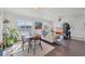 Light-filled dining area with mid-century modern furniture at 2950 Viscaya Pl # 108, Sarasota, FL 34237