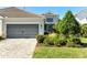 Single-story home with two-car garage and manicured lawn at 3028 Sky Blue Cv, Bradenton, FL 34211