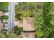 An aerial view showcasing a townhouse nestled amongst lush green trees at 3415 51St Avenue W Cir # 206, Bradenton, FL 34210
