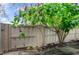Neatly landscaped backyard with a white fence and lush greenery at 3415 51St Avenue W Cir # 206, Bradenton, FL 34210