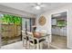 Dining area with wooden table and chairs, and access to patio at 3415 51St Avenue W Cir # 206, Bradenton, FL 34210