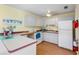 Efficient kitchen with white cabinets and modern appliances at 3415 51St Avenue W Cir # 206, Bradenton, FL 34210