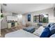 Living room with L-shaped sofa, TV, and staircase at 3415 51St Avenue W Cir # 206, Bradenton, FL 34210
