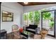 Relaxing screened porch with wicker furniture and access to the backyard at 3415 51St Avenue W Cir # 206, Bradenton, FL 34210