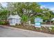 Community entrance sign with manicured landscaping, welcoming visitors to Southwinds Five Lakes at 3415 51St Avenue W Cir # 206, Bradenton, FL 34210
