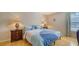 Cozy bedroom with wood floors, full bed, and two nightstands at 3609 59Th W Ave # 4045, Bradenton, FL 34210