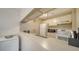 Well-equipped kitchen with white cabinets and appliances at 3609 59Th W Ave # 4045, Bradenton, FL 34210