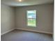 Simple bedroom with carpeted floor and window at 378 Rallus Rd, Venice, FL 34293