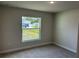 Bright bedroom with carpeted floor and window at 378 Rallus Rd, Venice, FL 34293