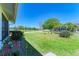 Landscaped backyard with pond and lush greenery at 4501 Peridia E Blvd, Bradenton, FL 34203