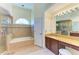 Bathroom boasts a large vanity, soaking tub, and separate shower at 4501 Peridia E Blvd, Bradenton, FL 34203