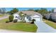 Single-story home with landscaped lawn, driveway, and attached garage at 4501 Peridia E Blvd, Bradenton, FL 34203