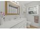 Clean bathroom with a vanity, toilet, and shower/tub combo at 5315 24Th St W, Bradenton, FL 34207