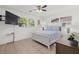 Main bedroom with a comfortable bed and large windows at 5315 24Th St W, Bradenton, FL 34207