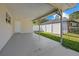 Covered carport with concrete flooring and access to backyard at 5315 24Th St W, Bradenton, FL 34207