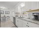 Modern kitchen with white cabinets and granite countertops at 5315 24Th St W, Bradenton, FL 34207