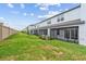 View of grassy backyard and townhouses at 5413 Tripoli Dr, Palmetto, FL 34221