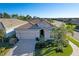 Single-story house with a driveway and surrounding neighborhood at 5628 Long Shore Loop, Sarasota, FL 34238