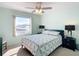 Guest bedroom with a queen bed and window views at 5725 Greenwood Ave # 6203, North Port, FL 34287