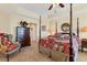 Spacious main bedroom with a four-poster bed at 6340 Watercrest Way # 202, Lakewood Ranch, FL 34202