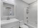 Clean bathroom with white vanity, tub, and shower at 6415 Coliseum Blvd, Port Charlotte, FL 33981