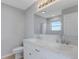 Modern bathroom with double vanity, large mirror, and shower/tub combo at 6415 Coliseum Blvd, Port Charlotte, FL 33981