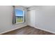 Bedroom with wood-look floors and a window with a view at 6415 Coliseum Blvd, Port Charlotte, FL 33981